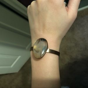 Gold bracelet with single stone .